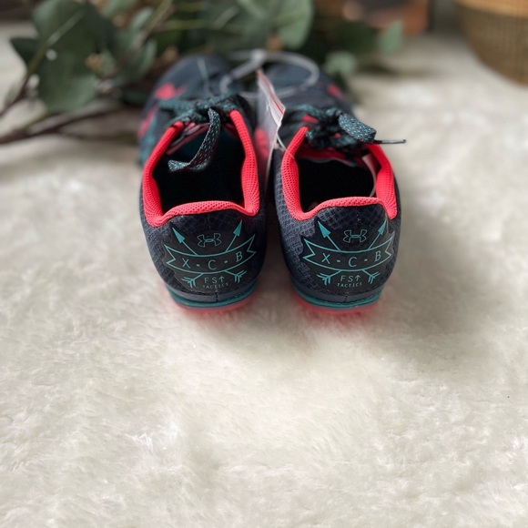 Under Armour Black and Red Athletic Shoes
Unisex Cross Country Shoes - Picture 9 of 10